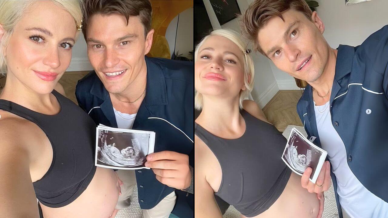 A couple proudly holds an ultrasound photo beside a pregnant pixie lott belly, celebrating their upcoming arrival in a cozy setting.