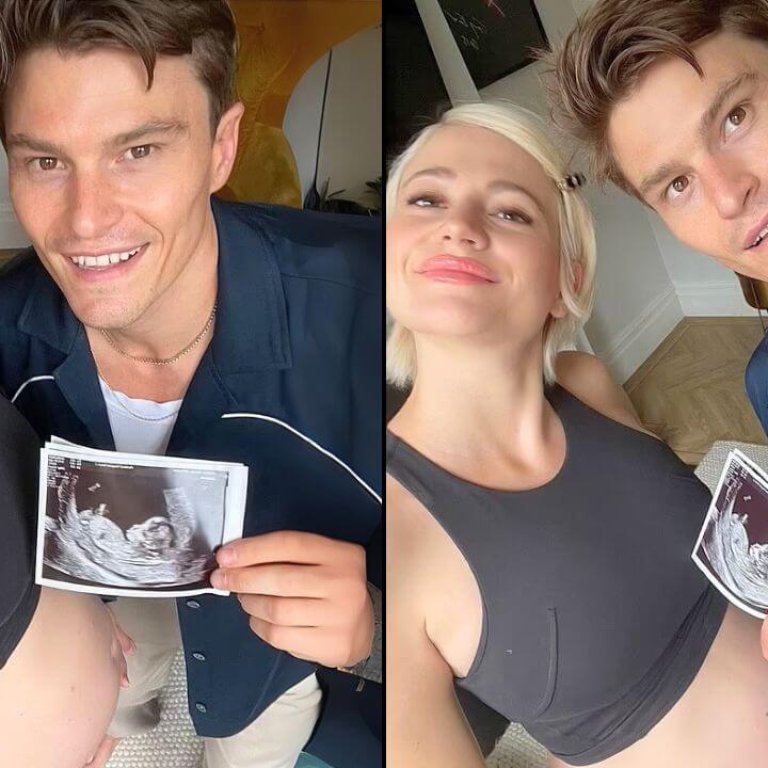 A couple proudly holds an ultrasound photo beside a pregnant pixie lott belly, celebrating their upcoming arrival in a cozy setting.